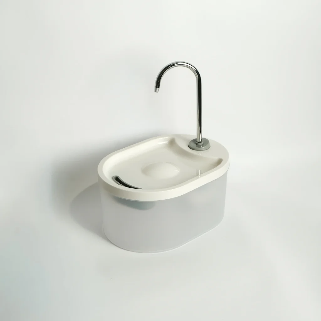 Angled view of the Furtopia faucet style pet water fountain in white, highlighting its compact, space-saving design.