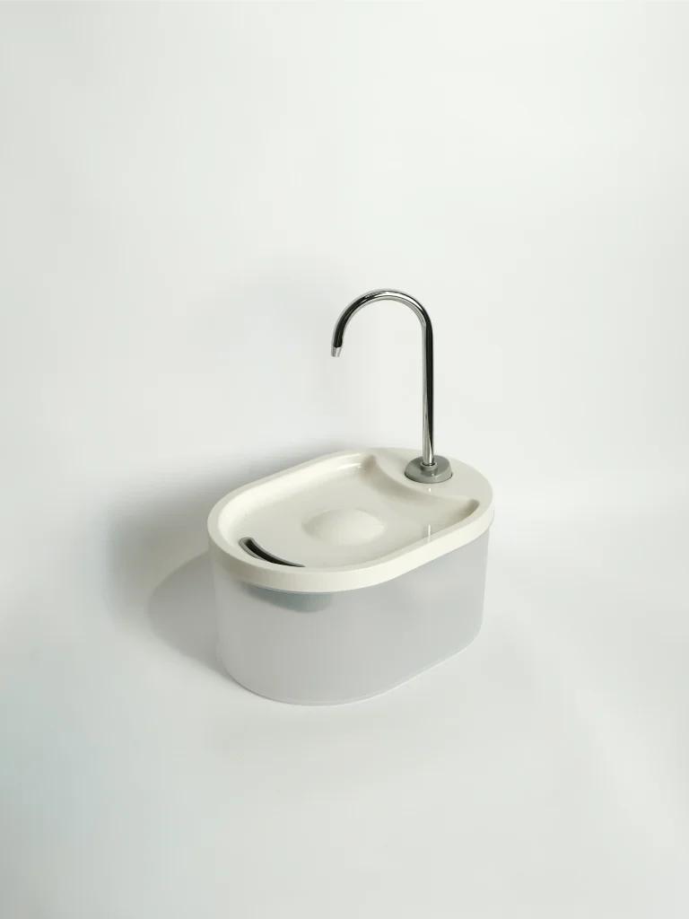White Faucet Style Pet Water Fountain showing the continuous tap-inspired stream for cat and dog hydration.