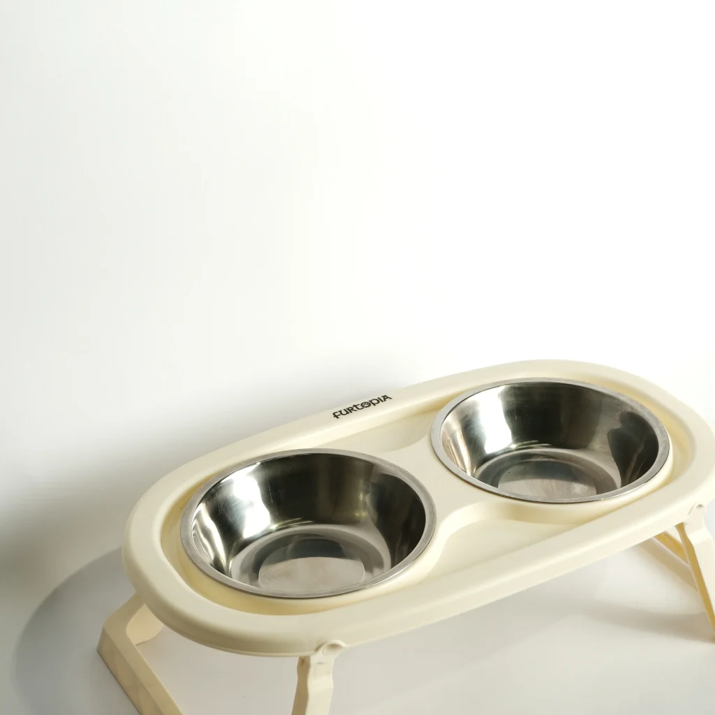 Side profile of the cream elevated double pet feeding bowl, highlighting the posture-improving height for pets.