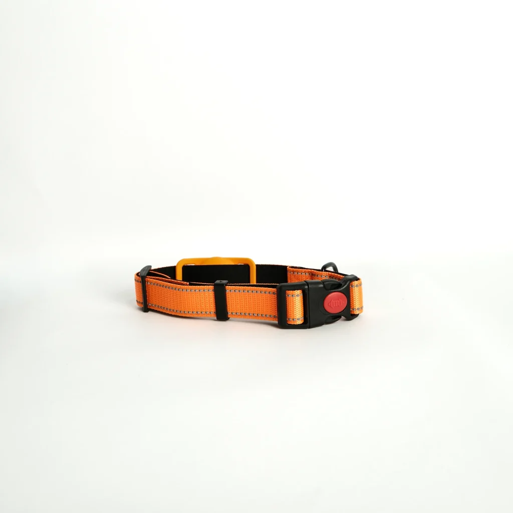 The Apple AirTag Dog Collar in peach laid flat, demonstrating its sleek design for modern pet safety and travel.