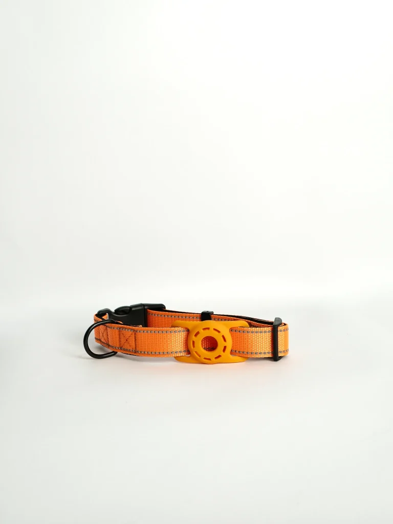 A close-up view of the adjustable pet tracker collar in peach, featuring durable stitching and a quick-release buckle.