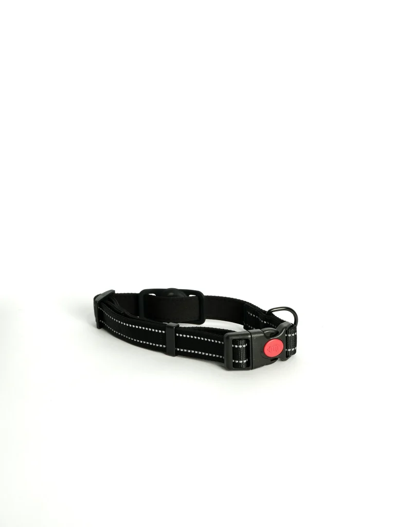 Adjustable Apple AirTag Dog Collar in black, laid flat to show the durable buckle and secure tracking slot.