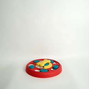 Top view of the interactive Dog Puzzle Feeder Toy featuring colorful sliding panels and hidden treat compartments.