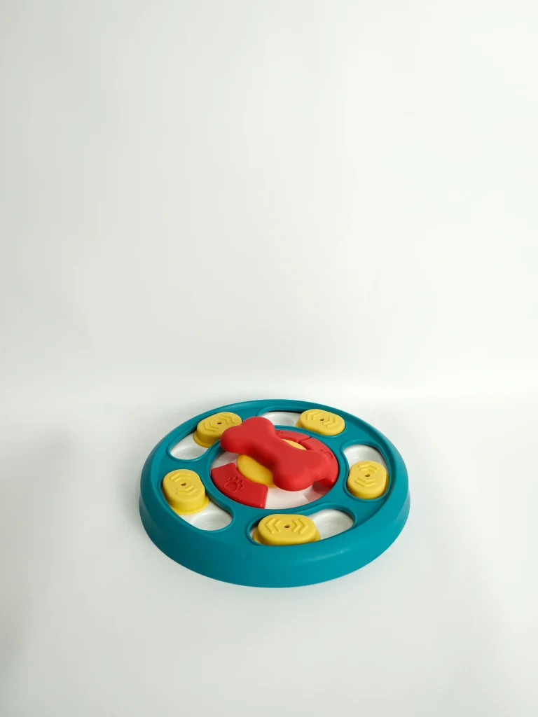Dog Puzzle Feeder Toy showing treats hidden inside the compartments to encourage natural foraging behaviors.