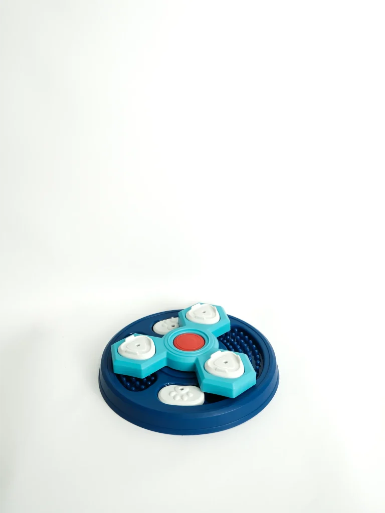 Interactive Dog Feeder Toy Circle Base on a white background showing the treat-dispensing hole and durable design.