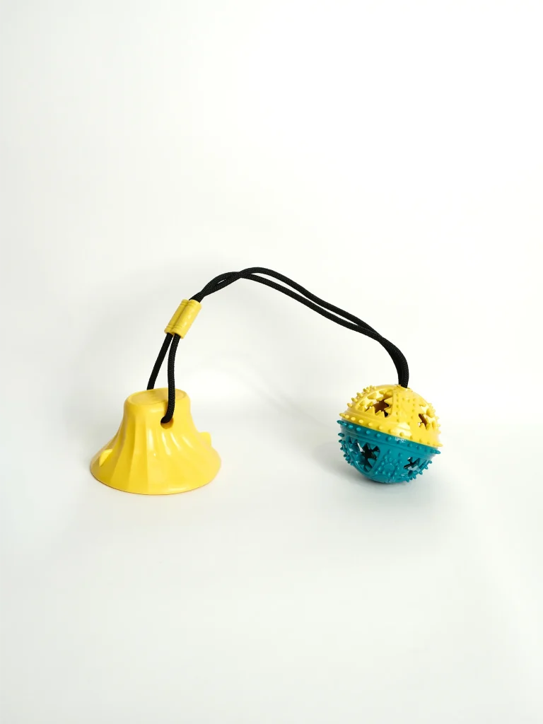 Dog Chew and Feeder Toy being filled with small treats to keep active dogs engaged and entertained.