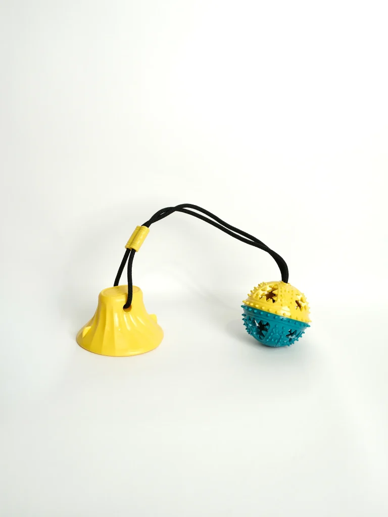 Furtopia Dog Chew and Feeder Toy displayed at an angle to show the long-lasting durable rubber construction.
