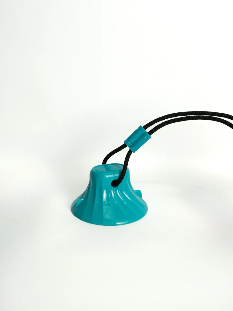 Close-up of the Dog Chew and Feeder Toy showing the textured surface for dental health and grip.